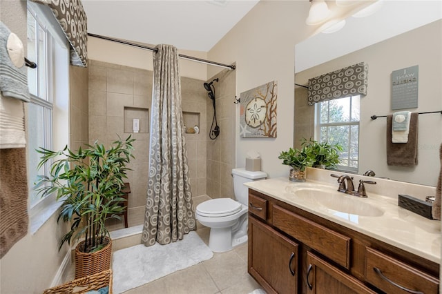 bathroom with walk in shower, tile patterned floors, vanity, and toilet