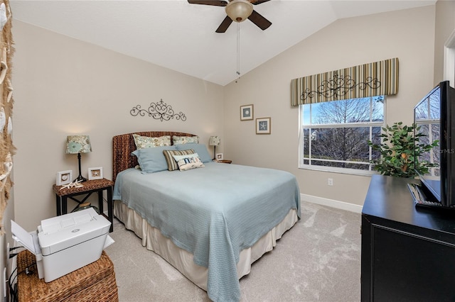 carpeted bedroom featuring lofted ceiling and ceiling fan