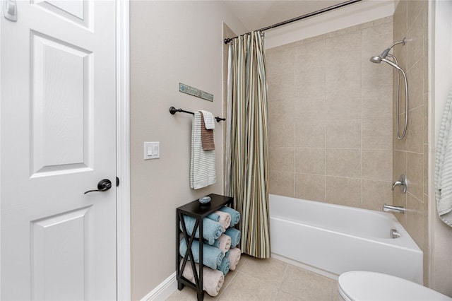 bathroom with tile patterned flooring, shower / bath combination with curtain, and toilet