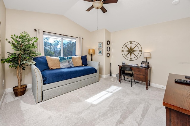 carpeted living room featuring ceiling fan and vaulted ceiling