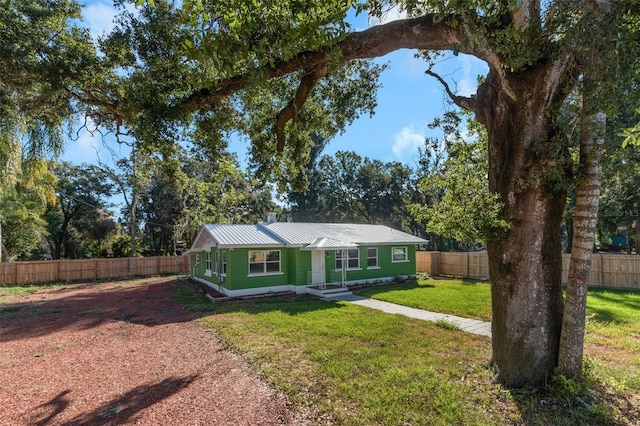 ranch-style house with a front lawn