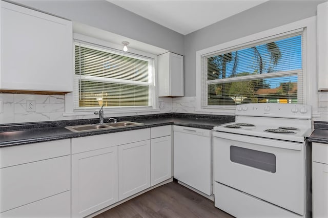 kitchen featuring sink, white cabinetry, dark hardwood / wood-style flooring, white appliances, and backsplash