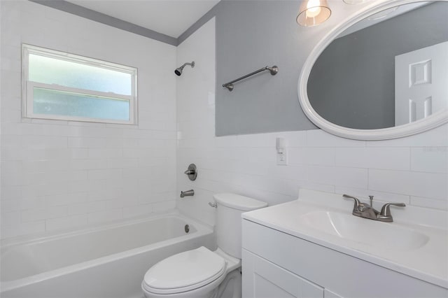 full bathroom featuring tile walls, decorative backsplash, tiled shower / bath combo, vanity, and toilet