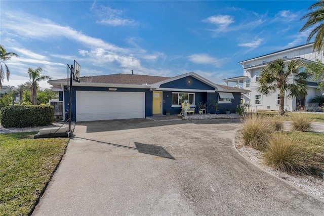 ranch-style house featuring a garage