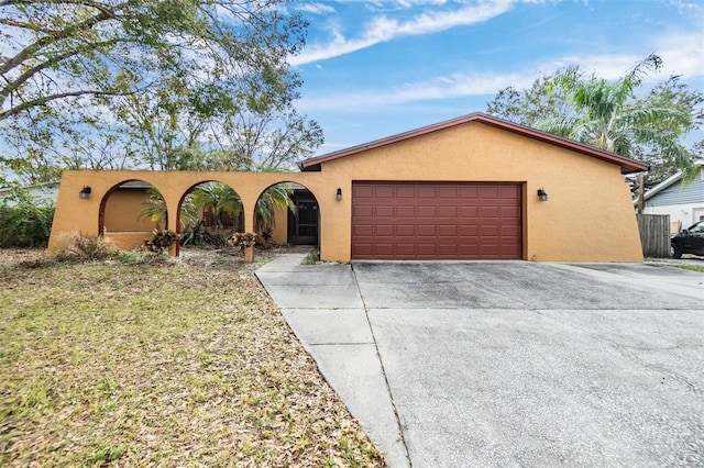 single story home featuring a garage