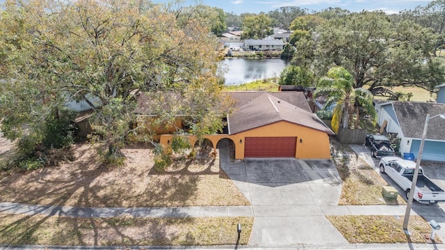 birds eye view of property featuring a water view