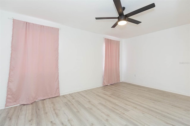 unfurnished room featuring ceiling fan and light hardwood / wood-style flooring