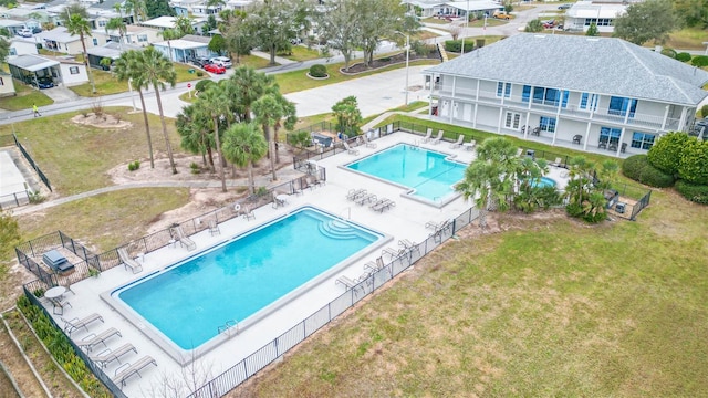 view of pool with a lawn and a patio area