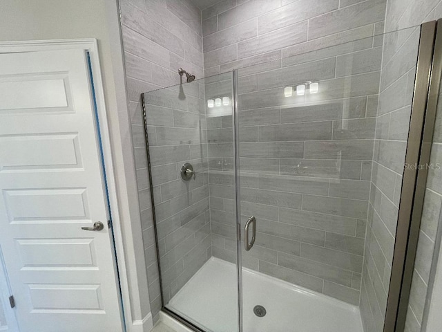 bathroom featuring an enclosed shower