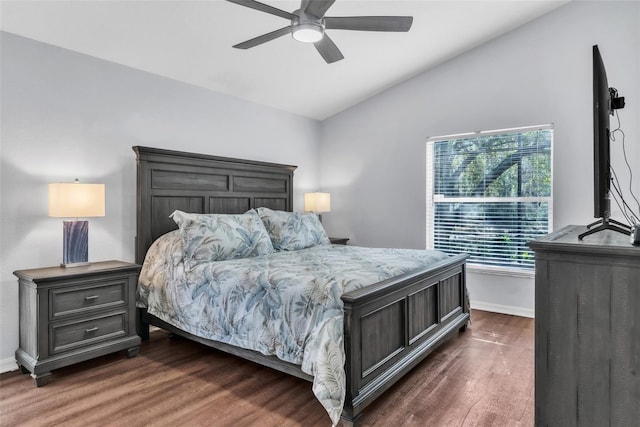 bedroom featuring dark wood-type flooring, ceiling fan, and vaulted ceiling