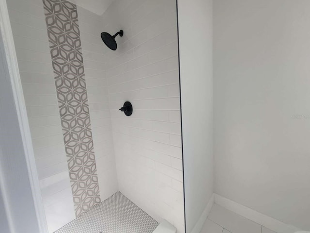 bathroom with tiled shower