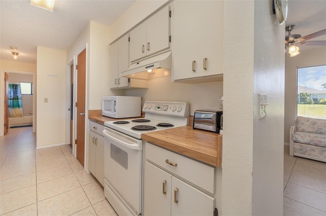 kitchen featuring light tile patterned floors, white appliances, ceiling fan, a textured ceiling, and white cabinets