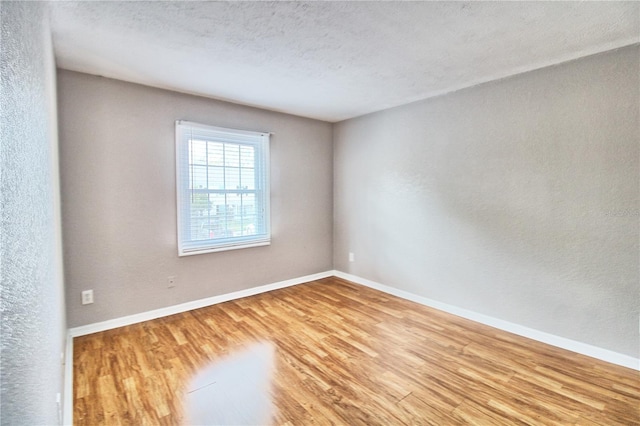 13760 Orange Sunset Dr Unit 201, Tampa, FL 33618 - empty room featuring hardwood / wood-style flooring and a textured ceiling