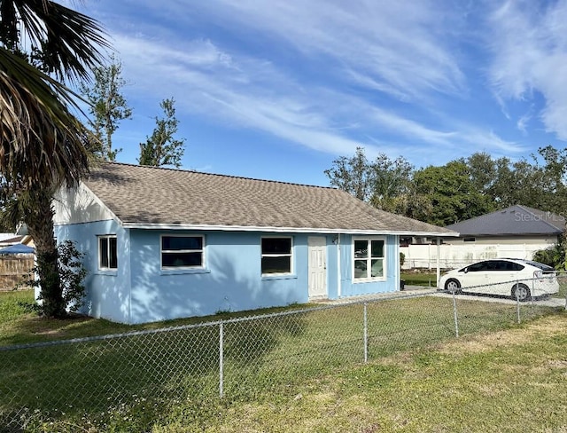 single story home featuring a front yard