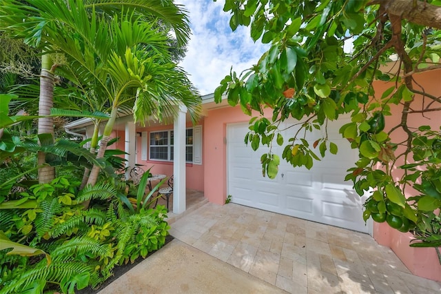 entrance to property featuring a garage