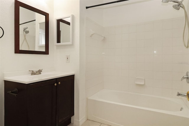 bathroom featuring tile patterned flooring, bathing tub / shower combination, and vanity