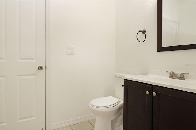 bathroom featuring tile patterned floors, toilet, and vanity