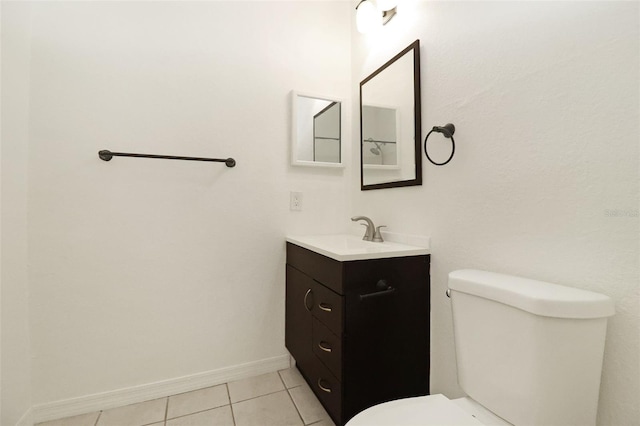 bathroom featuring tile patterned flooring, vanity, and toilet