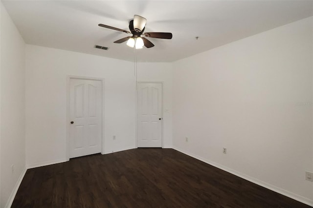 unfurnished room featuring ceiling fan and dark hardwood / wood-style flooring