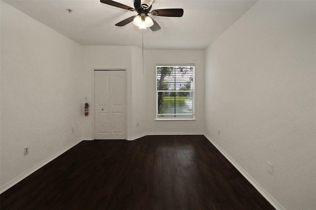 spare room with hardwood / wood-style floors and ceiling fan