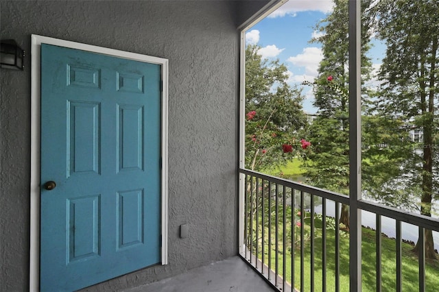 property entrance with a balcony