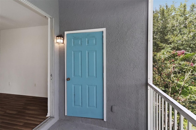 property entrance with a balcony