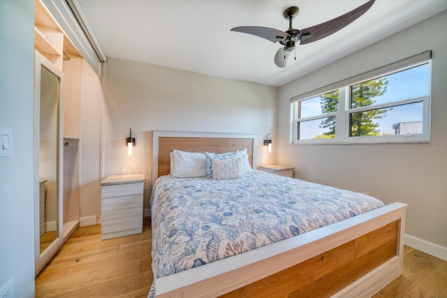 bedroom featuring light hardwood / wood-style flooring and ceiling fan