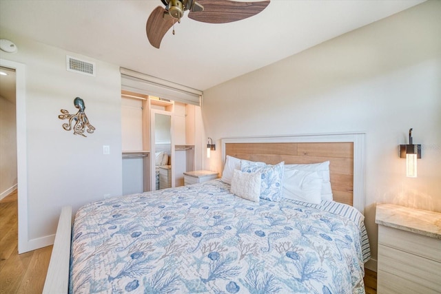 bedroom featuring light hardwood / wood-style floors and ceiling fan