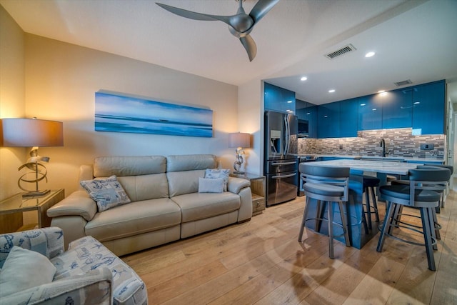 8565 W Gulf Blvd Unit 17S, Treasure Island, FL 33706 - living room with light wood-style flooring, a ceiling fan, and recessed lighting