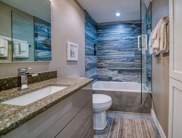 8565 W Gulf Blvd Unit 17S, Treasure Island, FL 33706 - bathroom with toilet, vanity, tiled shower / bath, and a textured wall