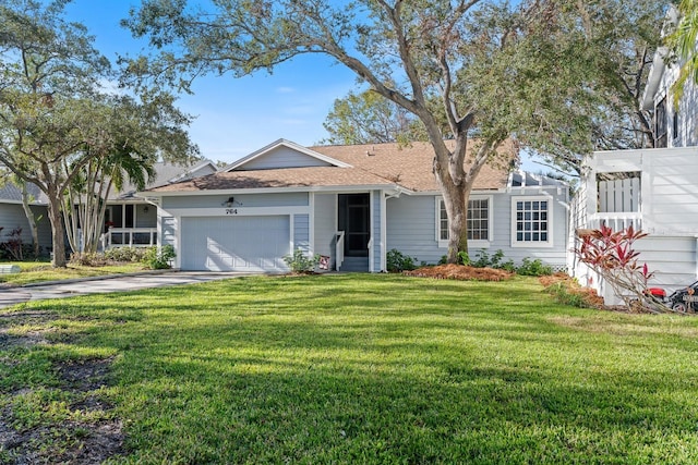 ranch-style house with a garage and a front lawn