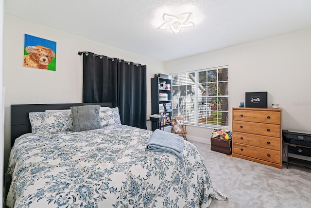 carpeted bedroom with a textured ceiling