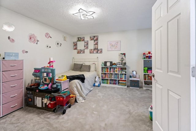 bedroom with carpet and a textured ceiling