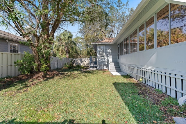 view of yard featuring a sunroom