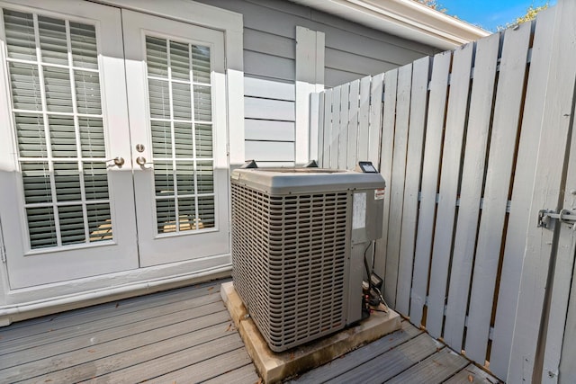 details with central AC unit, french doors, and indoor bar