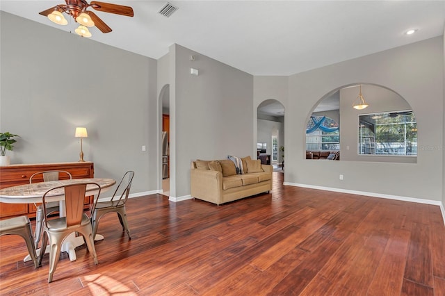 living room with hardwood / wood-style flooring and ceiling fan