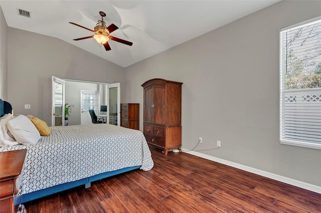 bedroom with ceiling fan, lofted ceiling, and wood-type flooring