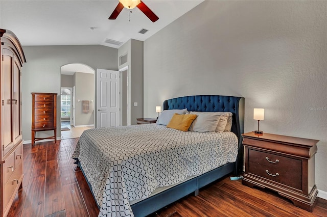 bedroom featuring ceiling fan, lofted ceiling, and dark hardwood / wood-style floors