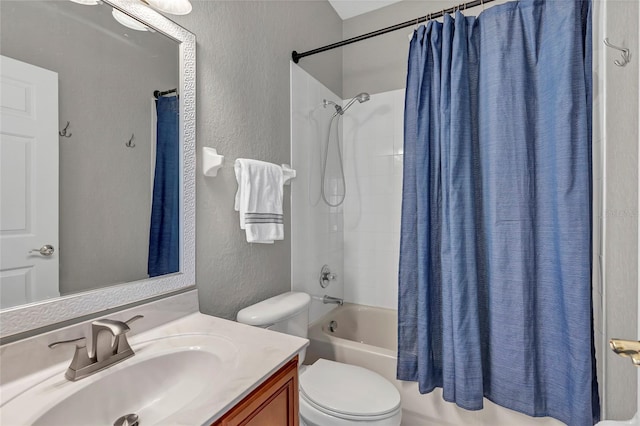 full bathroom with shower / tub combo with curtain, vanity, and toilet