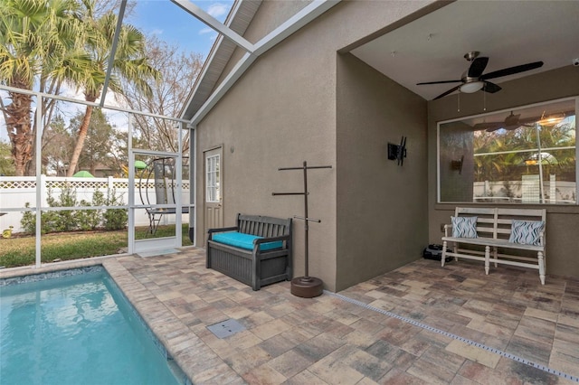 exterior space with a fenced in pool, a lanai, and ceiling fan