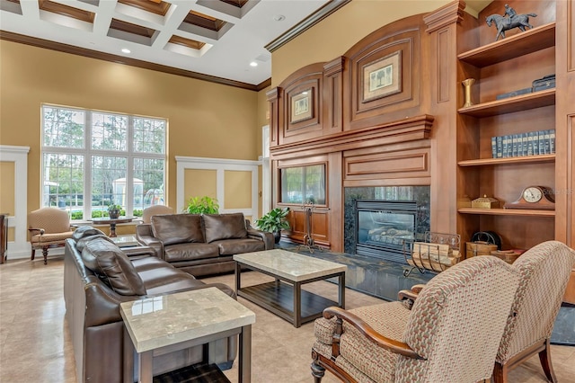 living room with coffered ceiling, beam ceiling, ornamental molding, a premium fireplace, and a high ceiling