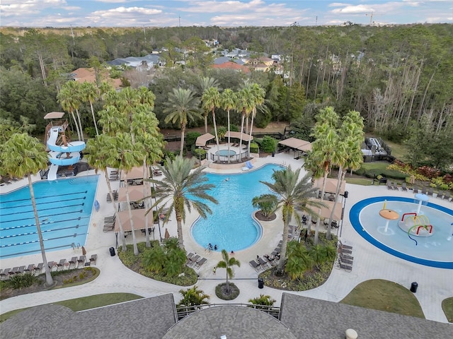 view of swimming pool featuring a patio and a water slide