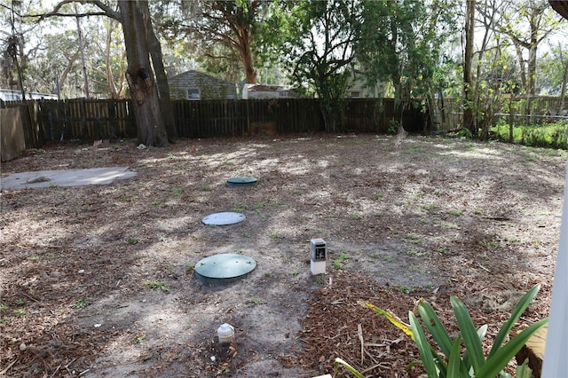 view of yard featuring a fenced backyard