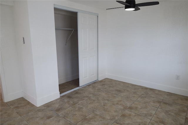 unfurnished bedroom with a closet, ceiling fan, and light tile patterned flooring