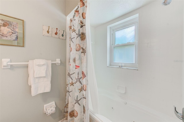 bathroom featuring shower / tub combo with curtain