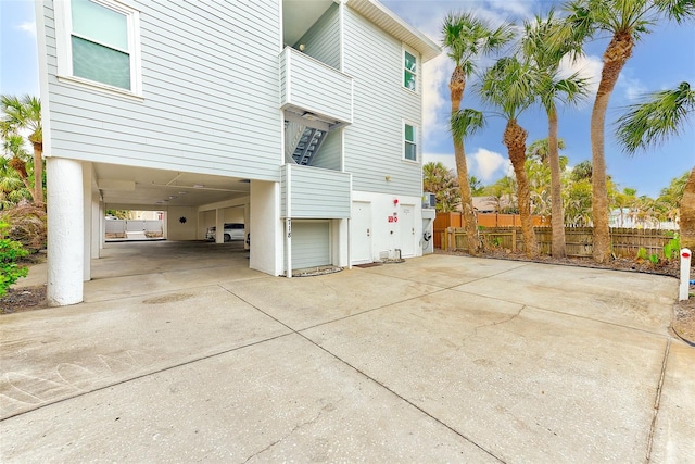 view of side of home featuring a carport