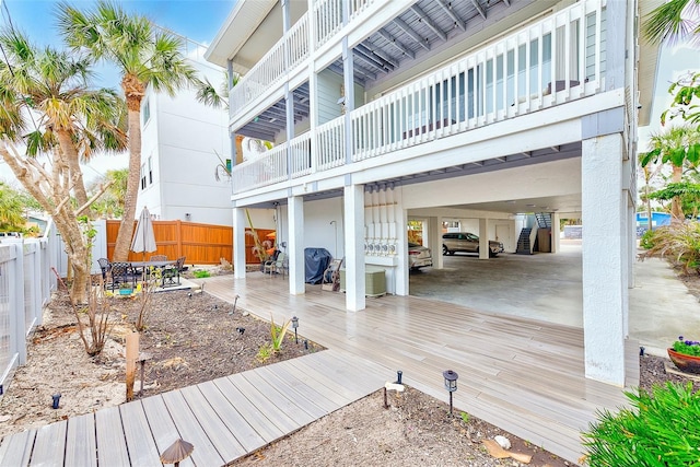 rear view of property featuring fence private yard, outdoor dining area, and a patio area