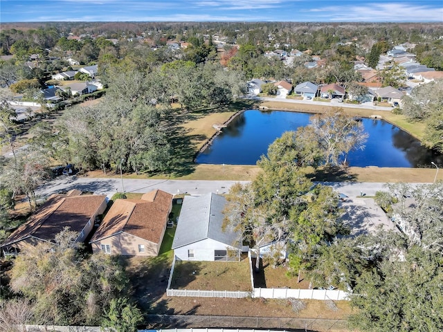 drone / aerial view featuring a water view and a residential view