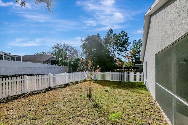 view of yard with a fenced backyard