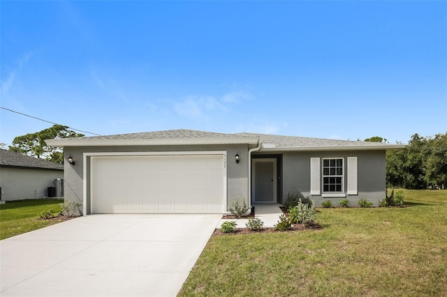 ranch-style home featuring a garage and a front yard